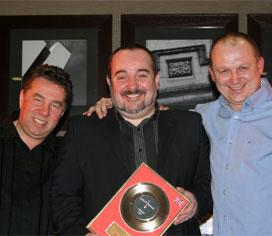Receiving an another award from directors of Unit One Entertainment, Steve Sale & Jonny Spangles